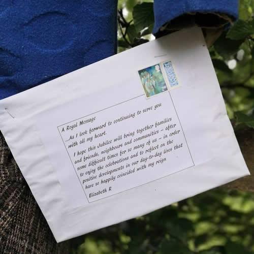 Photo Gallery Image - A close up of the letter being posted 