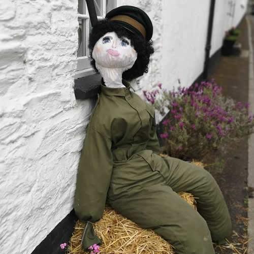 Photo Gallery Image - Land Girl sitting on a straw bale