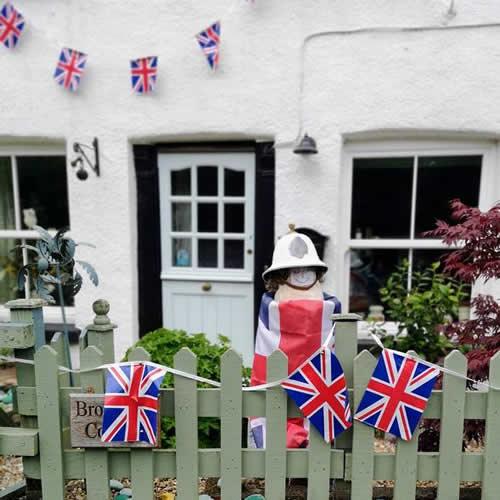 Photo Gallery Image - A guard on duty with Union Jacks